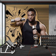 African Man Holding Dumbbells With Beige Background | Gym Wallpaper Mural - Prime Décor